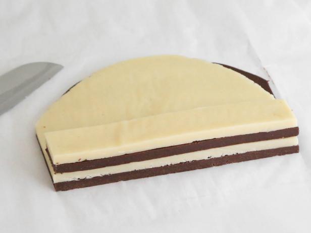 Stack strips on top of each other to form a stack 6 layers high, alternating vanilla and chocolate.