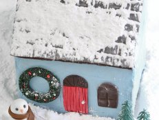 Blue Gingerbread House With Royal Icing and Chocolate Fondant