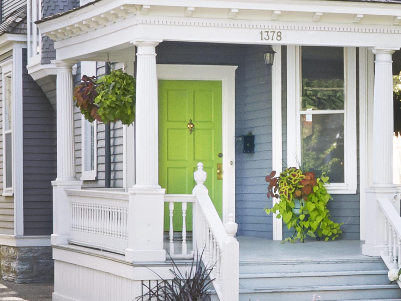 Front Porch With Hanging Plants And Lime Green Door Hgtv