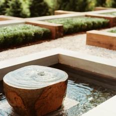 Stone Water Fountain in Contemporary Courtyard