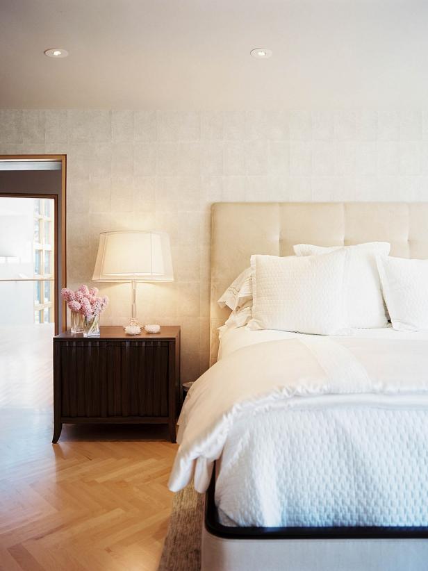 Transitional Neutral Bedroom With Herringbone Wood Flooring