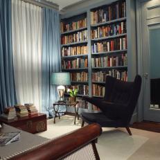 Traditional Blue Library With Seating Area