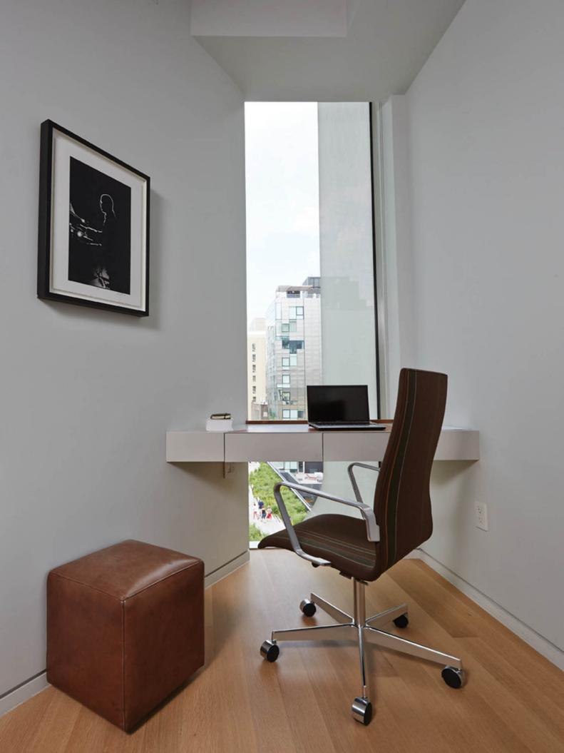 White Corner Home Office with Slab Desk and Leather Ottoman