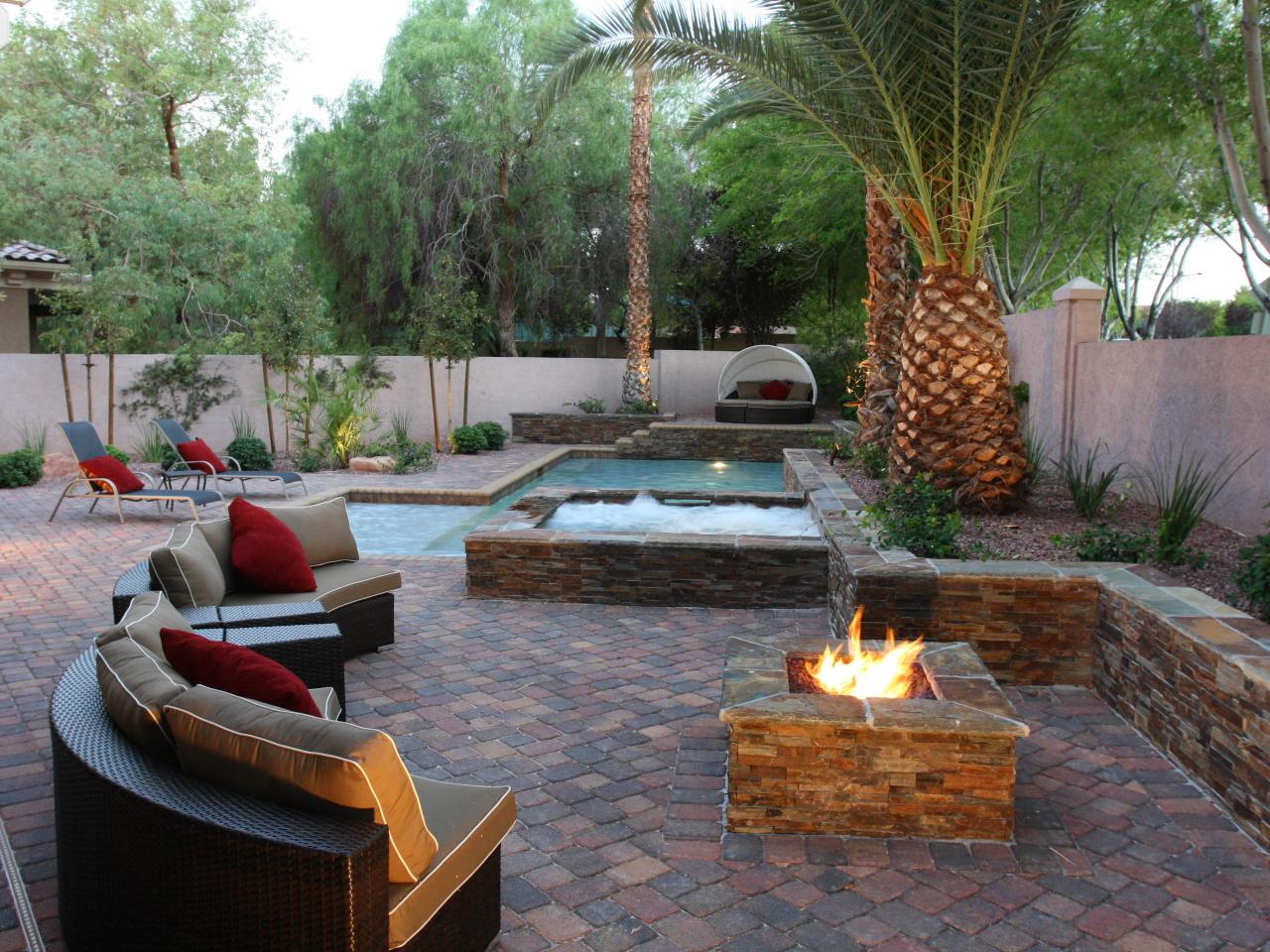 Stone Patio with Pool and Fire Pit | HGTV