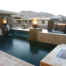 Modern Tiered Pool with Waterfall and Fire Urns