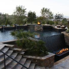 Eclectic Pool with Multiple Levels Mixes Water & Fire