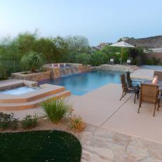 Spacious Patio Boasts a Stunning Pool With Fountains