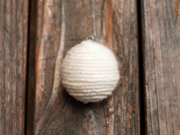 Once foam ball is completely covered, cut yarn and glue end to the bottom of the ball.