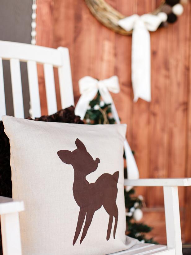 Greet guests by displaying this reindeer pillow near your front door. A chair is a perfect spot for  showcasing.