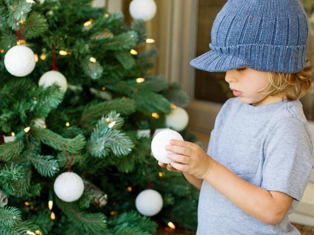 Boy Holding Handmade Snowball Ornament