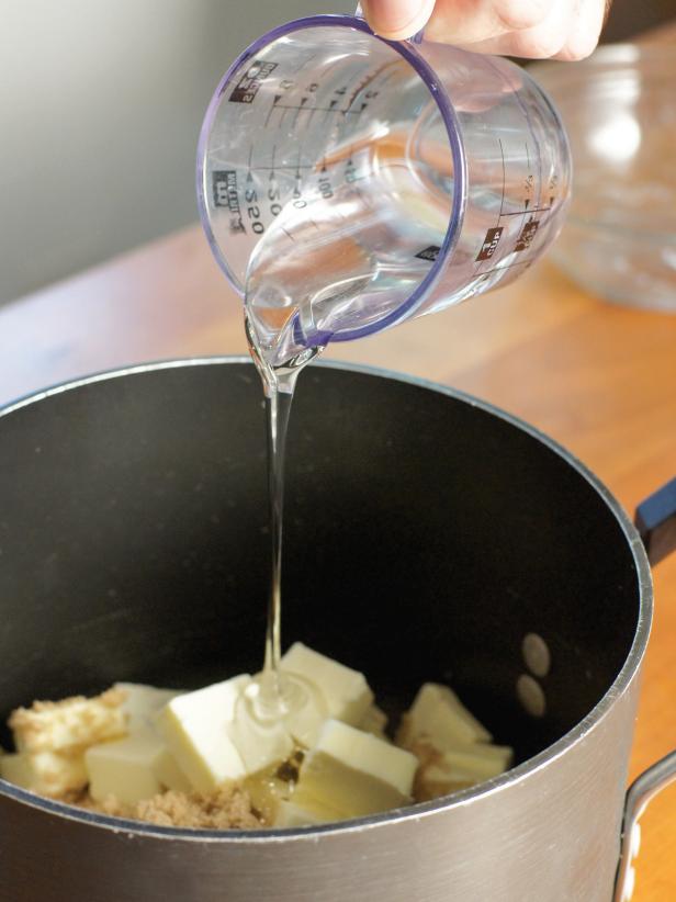 In a large pot, place the butter, brown sugar, 1 teaspoon salt, and corn syrup over medium low heat. Cook, stirring occasionally until mixture comes to a boil. After mixture begins to boil, continue cooking for 5 minutes stirring constantly.