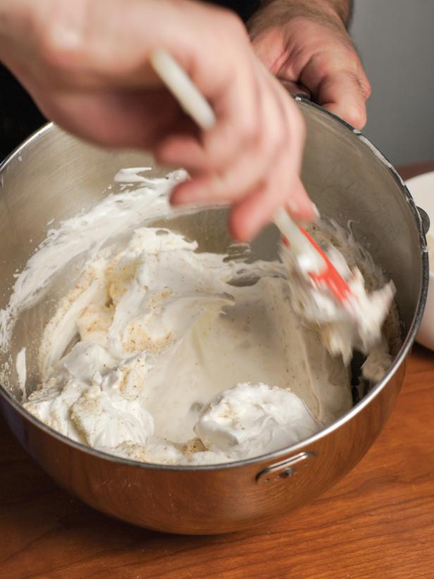 Turn mixer to high speed and very gradually sprinkle in the 1/3 cup superfine sugar. Whip on high speed until very stiff peaks form. Gently fold in ground almonds.