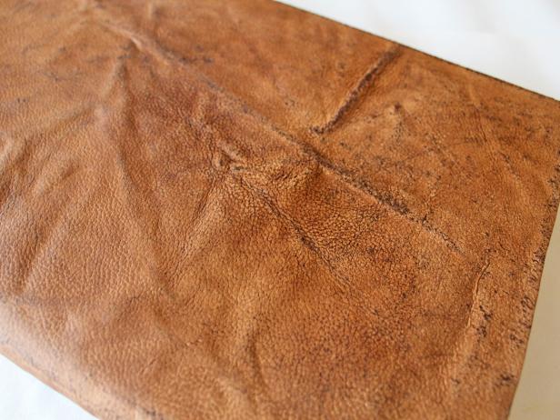 Leather for a gorgeous DIY book cover that has been stained and distressed to get this antique look. These covers make great gifts for the holidays.