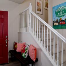 Country-Style Entryway and Stairs With Bold Red Front Door