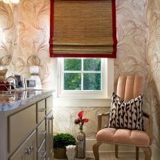 Transitional Bathroom With Pink Armchair and Wallpaper