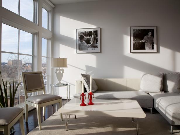 Contemporary White Living Room with Red Accents and Large Windows