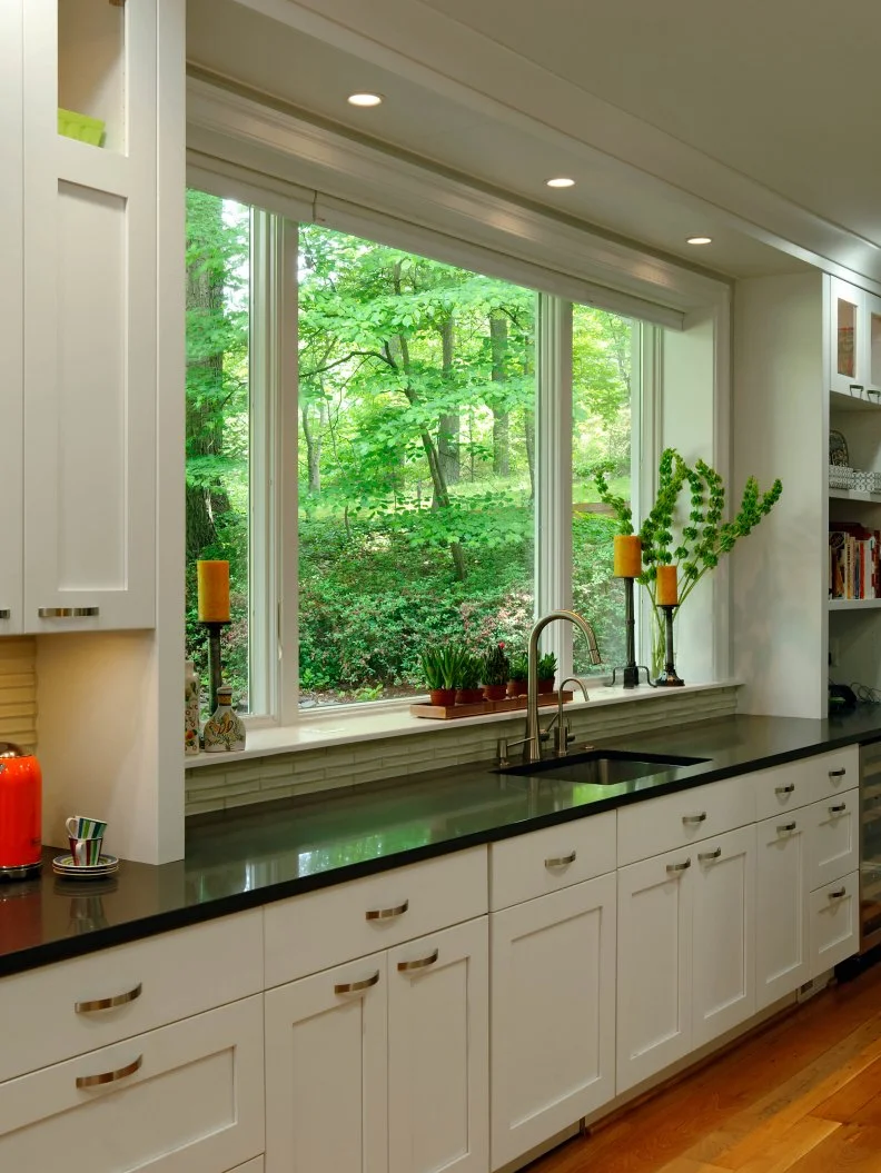 Galley Kitchen with Natural Light White Kitchen with Large Window and Black Quartz Countertop