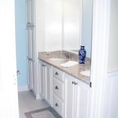 Beautiful Built-In Cabinetry in Small Powder Blue Bathroom