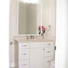 Beige Powder Room With Shaker-Style Cabinets