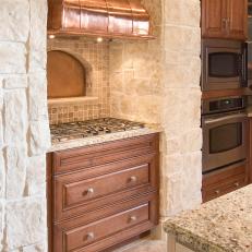 Kitchen With Copper Range Hood Is Warm, Inviting
