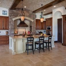 Tuscan Kitchen With Barrel Ceiling and Stone Hearth
