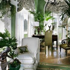 Green Living Room With Soaring Arched Windows