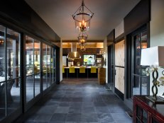 Wide Foyer With Slate Floor and Glass Urn Pendants