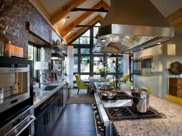 Galley Kitchen With Vaulted Ceiling And Stainless Range Hood