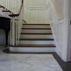 Sweeping Staircase And Marble Entry