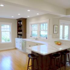 Kitchen with Creamy Calacatta Marble Countertops