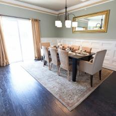 Contemporary Green Dining Room With White Wainscoting