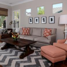 Living Room With Chevron Rug and Coral Accents