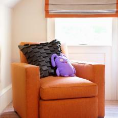 Contemporary Kid's Room With Comfy Orange Armchair