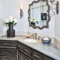 Neutral Bathroom With Old World-Style Sconces and Vanity
