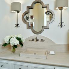 Neutral Transitional Bathroom With Quatrefoil Mirror