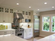 Transitional Kitchen With White Subway Tiles and Marble Countertops