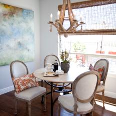 Transitional Dining Room Nook with Colorful Artwork