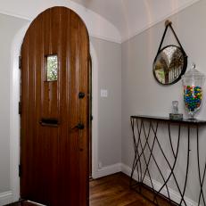 Neutral Entryway with Arched Front Door