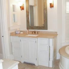 Bronze Fixtures Spice Up Traditional White Bathroom