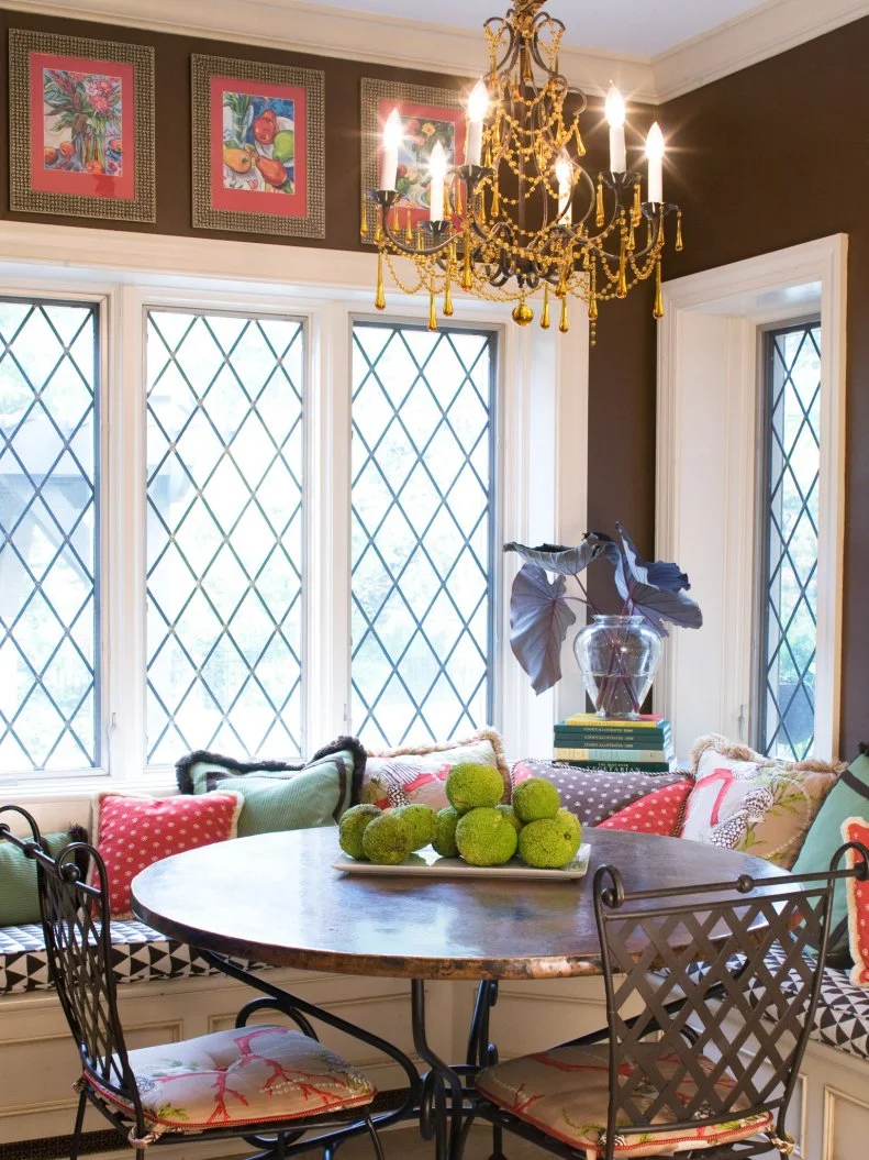 Bohemian Breakfast Nook with Chandelier and Graphic Throw Pillows Brown Breakfast Nook with Chandelier and Graphic Bench