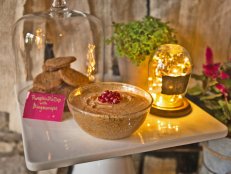 gingersnap cookies and pumpkin pie dip topped with pomegranate seeds