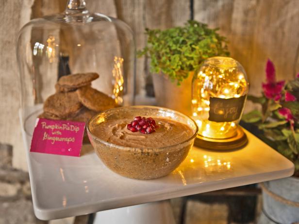 gingersnap cookies and pumpkin pie dip topped with pomegranate seeds