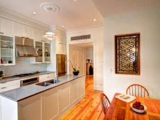 White Shaker Cabinets with Pine Floor and Center Island