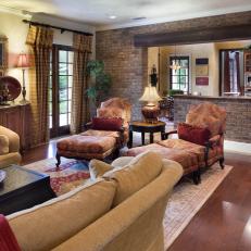 Tuscan Living Room With Brick Accent Wall is Cozy, Inviting