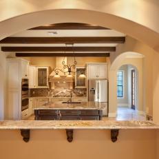 Framed Arch & Breakfast Bar in Tuscan-Style Kitchen