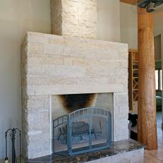 Southwestern Living Room With Stone Fireplace