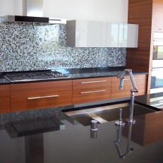 Sleek Kitchen With Black Granite Countertops