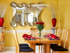 Dining Area With Yellow Walls and Contemporary Mirror