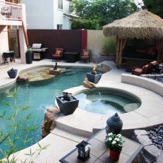 Pool With Tiki-Style Cabana and Raised Spa