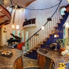 Eclectic Foyer With Grand Staircase